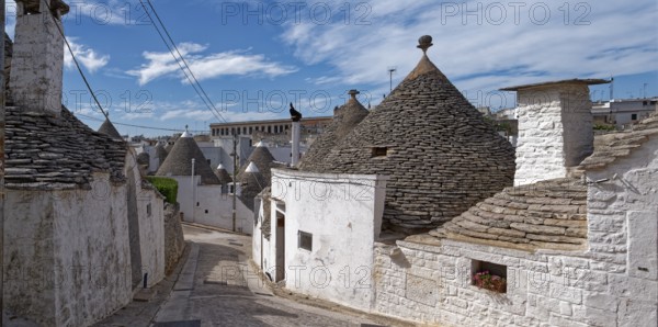 Whitewashed trulli, round houses with stone roofs, in the southern Italian town of Alberobello. The