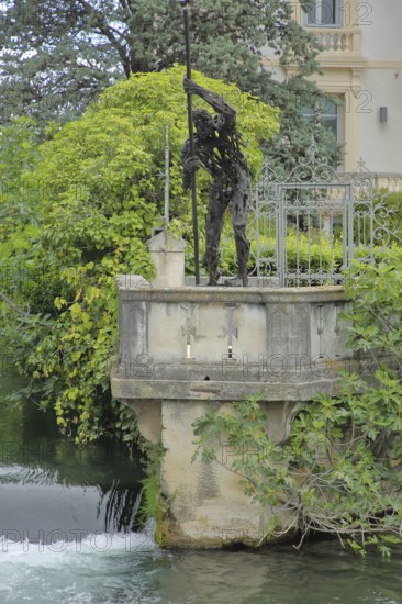 Sculpture Quo Vadis by Raphael Thierry standing on the river La Sorgue, man, raftsman with pole,
