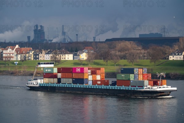 The river Rhine near Duisburg, houses on the Rhine dyke, Laar district, Thyssenkrupp Steel