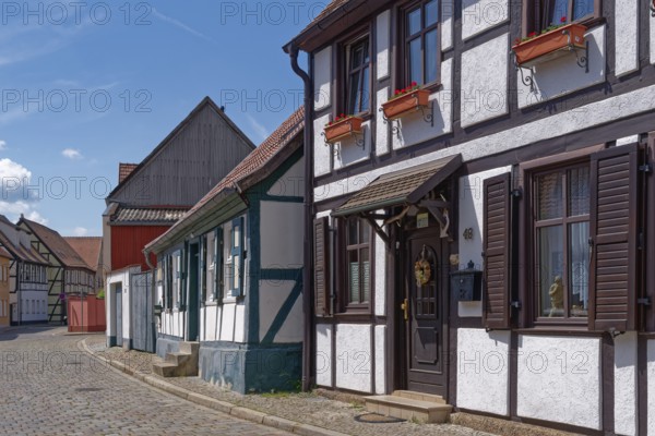 Half-timbered houses in the Lange Fischerstraße, covered with cobblestones, in the old town of
