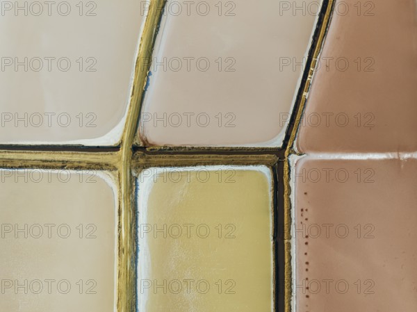 Saline ponds at the Bonanza salt works near Sanlúcar de Barrameda. The reddish colour depends on