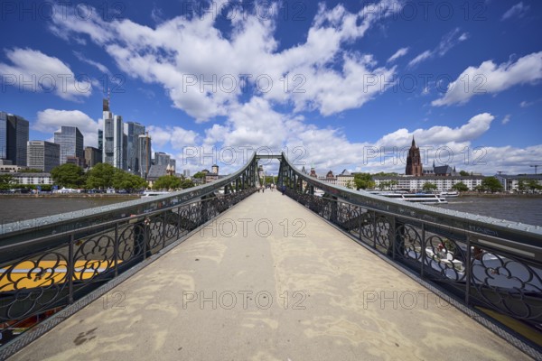 Iron footbridge with a view of the Mainkai and the skyscrapers in Frankfurt am Main, Hesse,