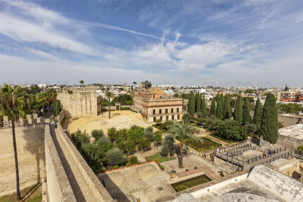 View from above of a city with historic buildings and a castle under a blue sky, Jerez