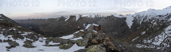Panorama, Snowy mountain landscape, mountain hut Ramolhaus in autumn with snow, at sunset, view of
