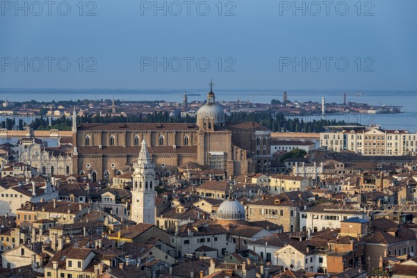 View over the roofs of Venice to the church Basilica dei Santi Giovanni e Paolo in the evening