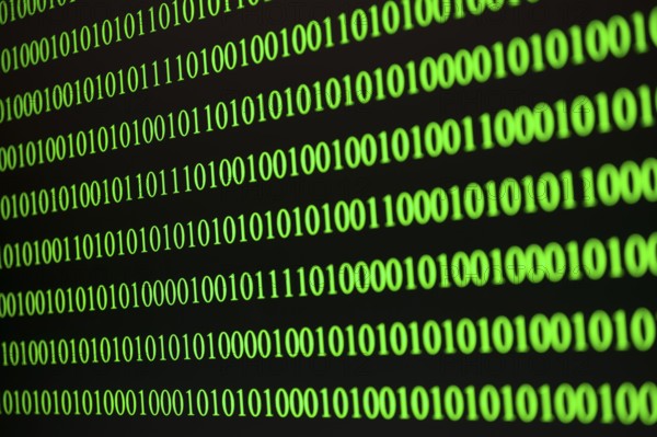 Parallel green binary code lines on a black background