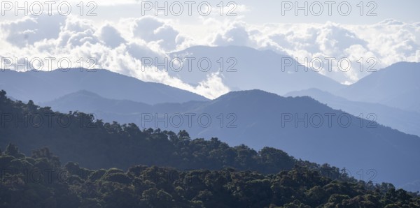 View of hills with cloud forest, Dramatic clouds between the mountains, Province of San José, Costa