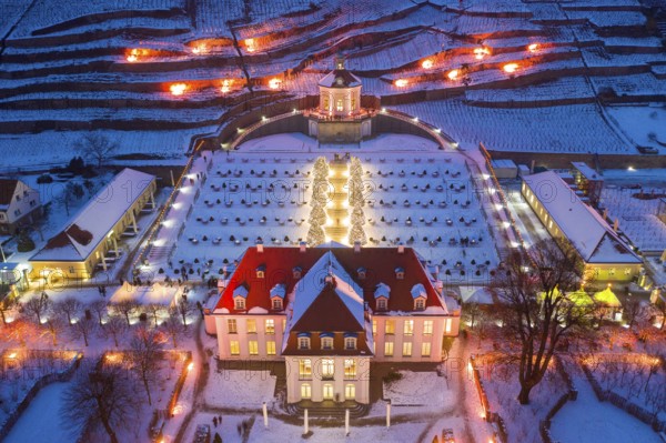 Aerial view of Wackerbarth Castle with castle park, belvedere and vineyards with snow and Christmas
