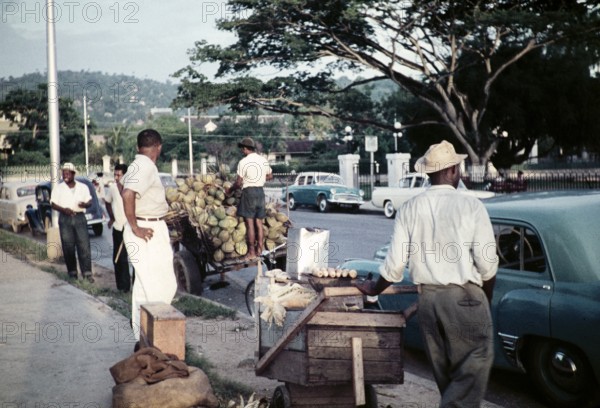Street traders on pavement opposite Queen's Park Savannah, Port of Spain, Trinidad, 1963