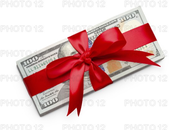 Stack of one hundred dollard bills wrapped in a red ribbon and bow isolated on a white background