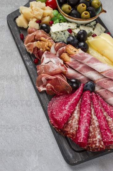 Appetizer, assortment, set, sausage, and cheese, on a wooden board, top view, no people