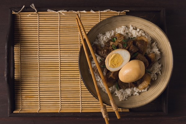 Stewed eggs, with pork belly, and rice, chinese food, homemade, selective focus, rustic, no people