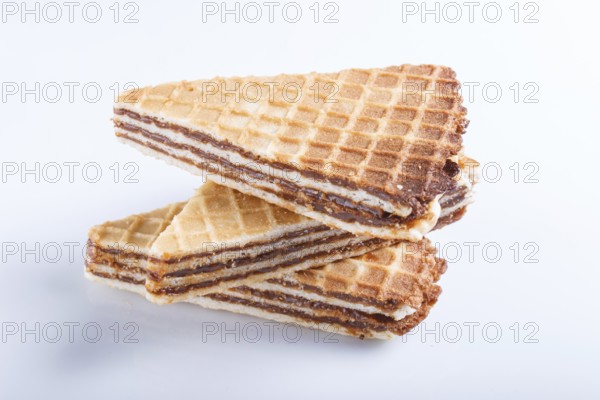 Waffle sandwiches with boiled condensed milk isolated on white background. closeup