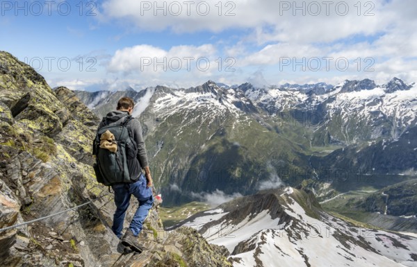 Mountaineers on a rope-insured hiking trail, breathtaking mountain landscape, view of Zemmgrund