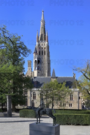 Church of Our Lady and the statue of one of the Four Horsemen of the Apocalypse, Bruges, Flanders,