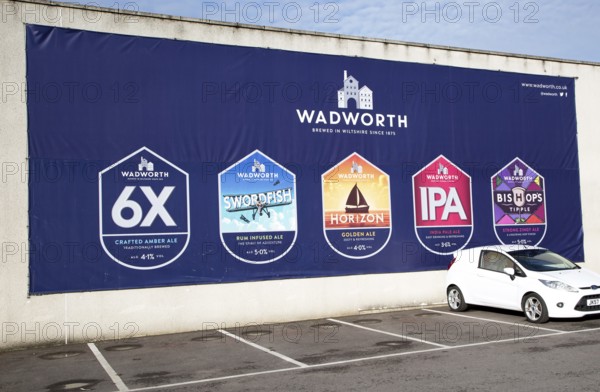 Billboard traditionally brewed beer advertising poster at Wadworth brewery, Devizes, Wiltshire,