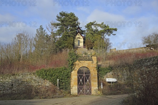 Neo-Gothic chapel built in 1890 with archway and stone wall on the hill, Heiligenblut, Alzey,