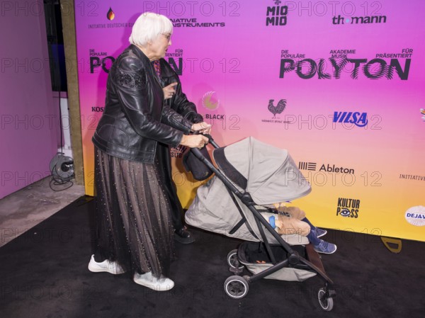 Claudia Roth (Bündnis 90/Die Grünen, Senator for Culture) with pram on the red carpet in front of