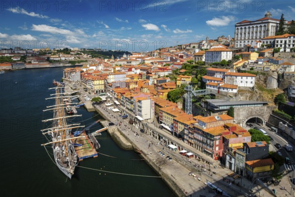 Aerial view of Porto city and Douro river with moored sailling ship from Dom Luis bridge I. Porto,