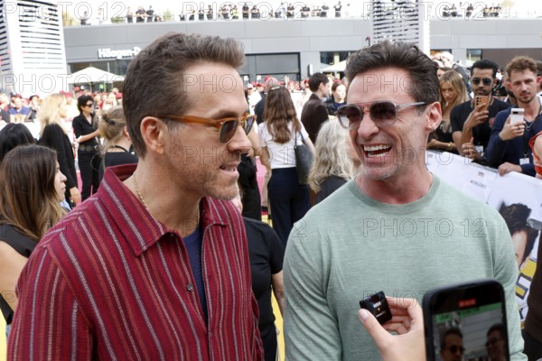 Ryan Reynolds and Hugh Jackmann at the Deadpool Wolverine fan event at Uber Platz in Berlin on 7