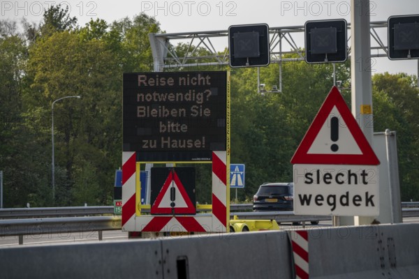 German-Dutch border at Emmerich-Elten, A3 motorway, signal board asks travellers to only make