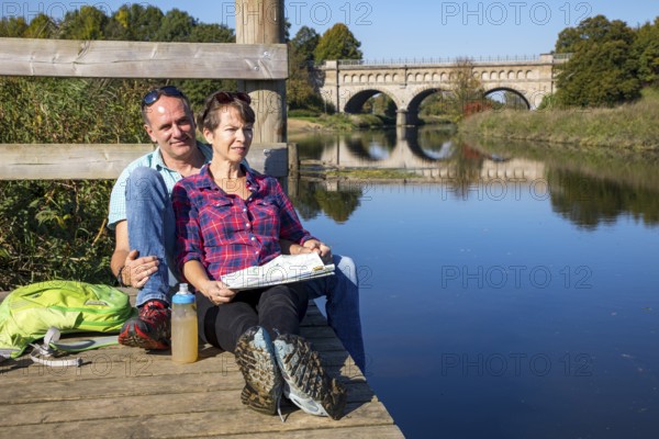 Hikers in the Steverauen Olfen, Alte Fahrt canal bridge, of the Dortmund-Ems Canal, a renaturalised