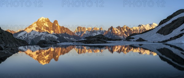 Evening mood, mountain landscape at sunset, alpenglow, water reflection in Lac Blanc, mountain