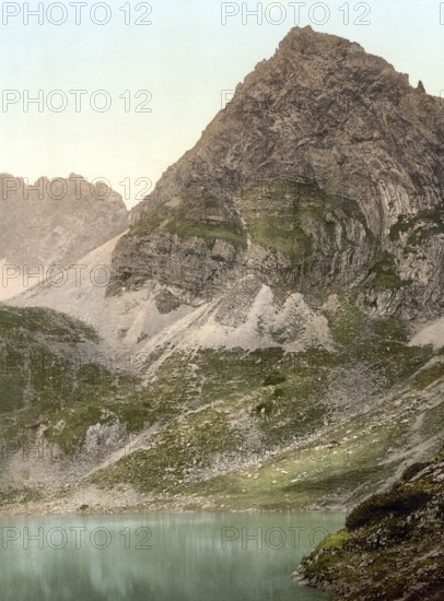 The Drachensee in the Mieminger Gebirge, surrounded by mountains such as the Sonnenspitze, the