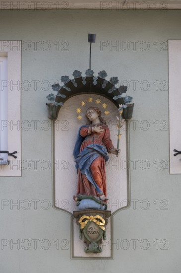 Figure of a saint on a house, Iphofen, Lower Franconia, Bavaria, Germany, Europe