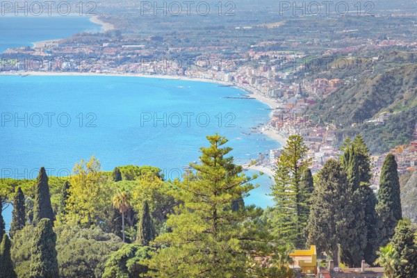 View of the Ionian coast and Giardini di Naxos in the distance, Taormina, Sicily, Italy, Europe