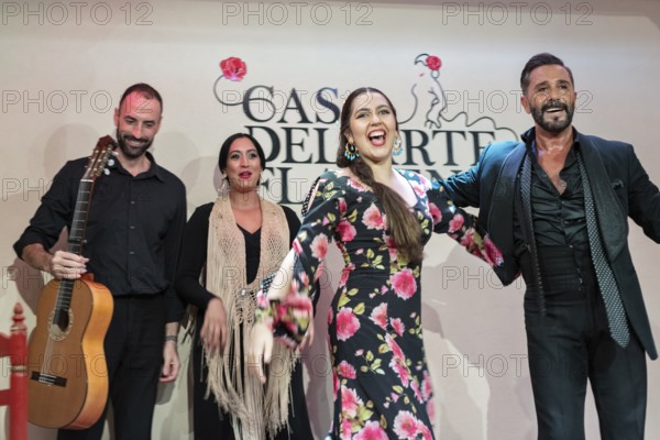 Happy flamenco group after a performance, joy and satisfaction in expression, Granada