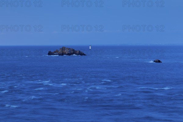 Evening view from the Pointe du Grouin with a view of the Phare de la Pierre-de-Herpin and striking