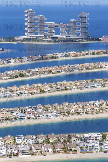 The Palm Jumeirah with Atlantis The Royal Hotel artificial island from above in Dubai, United Arab