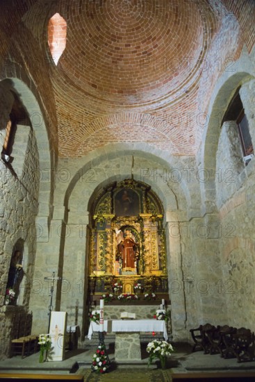 Interior of a church with magnificent altar, stone arches and religious decorations, Santuario de