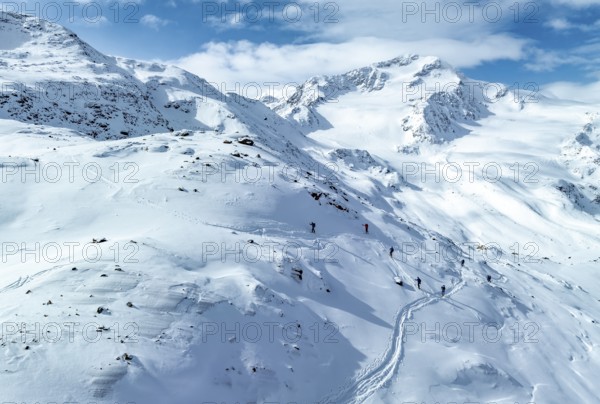 Aerial view, snowy mountain landscape, ski tourers on the ascent, behind Cevedale, Ortler group,
