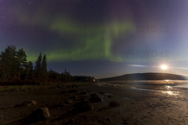 Northern lights, (Aurora borealis) at a lake near Kiruna, September 2024, Lapland, Sweden, Europe