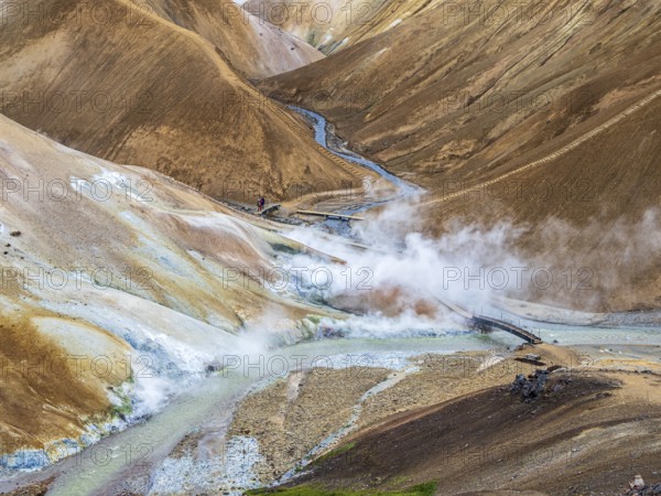 Steaming hot springs and colourful rhyolite mountains, hiking path, Hveradalir geothermal area,
