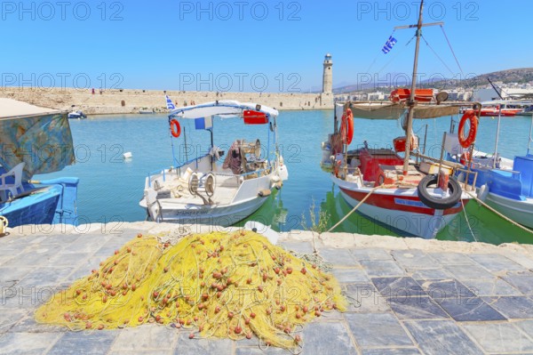 Fishing boat moored at Venetian harbour, Rethymno, Crete, Greece, Europe