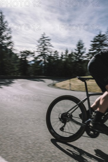 Road bike rider in spring between Lechtal and Tannheimer Tal in front of picturesque scenery of the