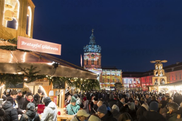 Mulled wine stand and Christmas pyramid at the Christmas market at Charlottenburg Palace. Berlin,