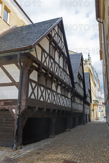 Narrow half-timbered house in a cobblestone alley, rustic atmosphere, Wallenstein houses, Liberec,