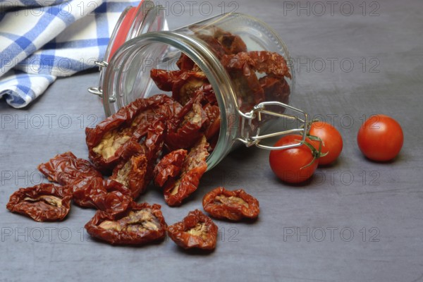Dried tomatoes in glass containers, Solanum lycopersicum