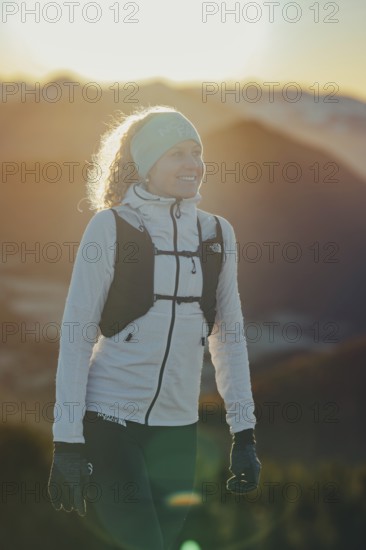 Trail running in autumn on the Jochberg on Lake Walchensee against the wonderful backdrop of the