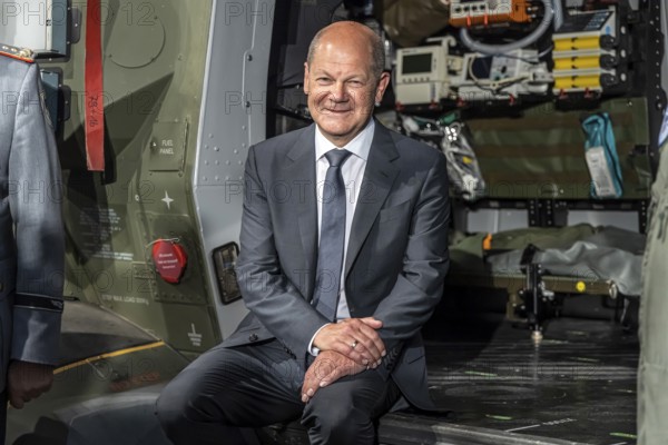 German Chancellor Olaf Scholz sits in a Bundeswehr NH90 helicopter, International Aerospace