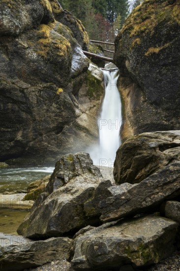 The lower part of the Buchenegg waterfalls, surrounded by rocks. Autumn. Oberstaufen, Upper Allgäu,