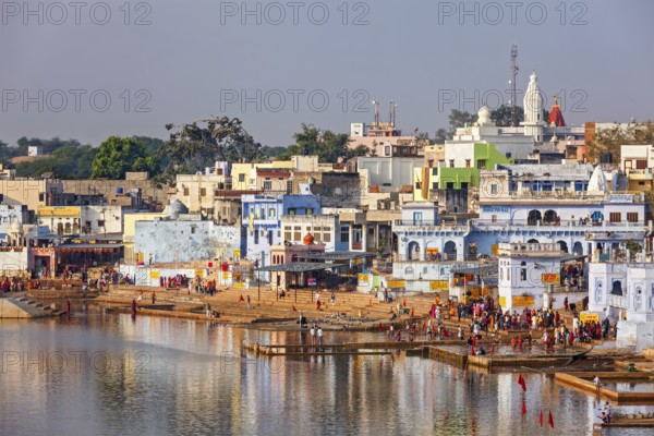 PUSHKAR, INDIA, NOVEMBER 20, 2012: Hindu devotees pilgrims bathing in sacred Puskhar lake (Sagar)