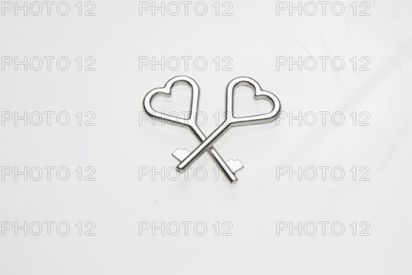 Two heart-shaped keys lie on top of each other
