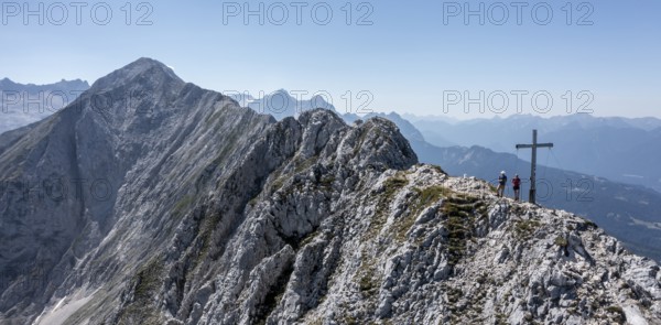 Aerial view, Alpine panorama, hikers at the summit cross, Westliche Wettersteinspitze, Wetterstein