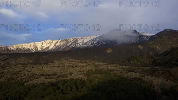 Snow-capped mountainsides, lava fields, morning light, Etna, volcano, Eastern Sicily, Sicily,
