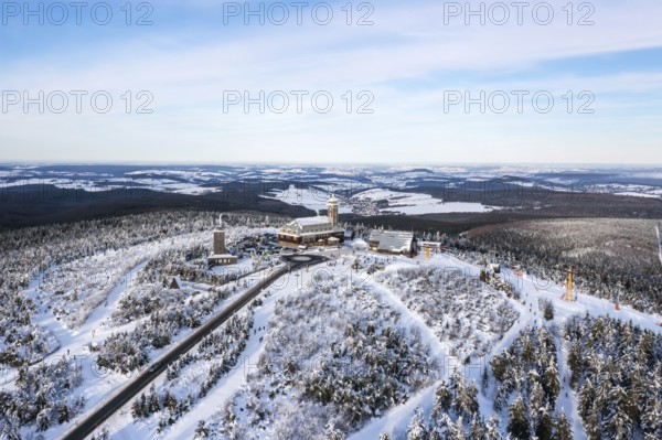 Fichtelberg highest mountain in the Ore Mountains in winter aerial view in Oberwiesenthal, Germany,